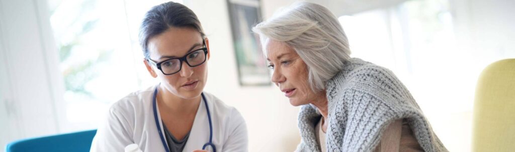 A woman and a doctor are talking to each other.